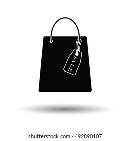 Shopping bag with sale tag icon. White background with shadow design. Vector illustration.