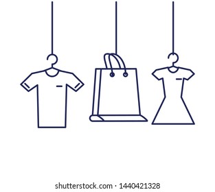 shopping bag with shirt and dress hanging