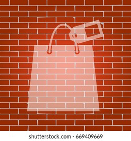 Shopping bag sign with tag. Vector. Whitish icon on brick wall as background.
