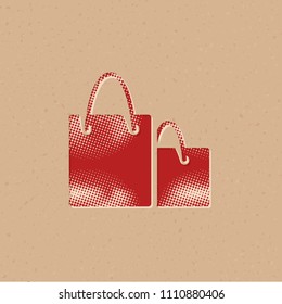 Shopping bags icon in halftone style. Grunge background vector illustration.