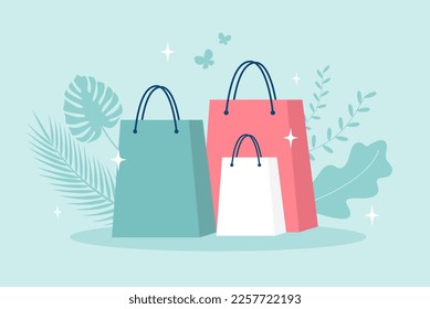Shopping bags with leaves and sparkles on a green background. Vector illustration in flat style