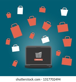 shopping basket with check out button on screen with  shopping bags on background