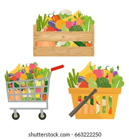 Shopping cart, basket and wooden box  with vegetables and fruits. 