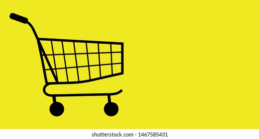 Shopping cart for Black Friday in the supermarket with copy space isolated on a yellow background.