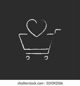 Shopping cart with heart hand drawn in chalk on a blackboard vector white icon isolated on a black background.