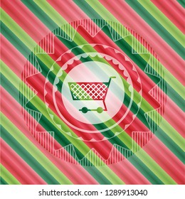 shopping cart icon inside christmas colors style emblem.