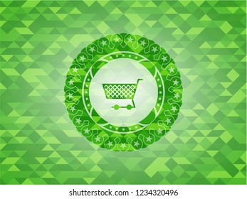 shopping cart icon inside green emblem with mosaic ecological style background
