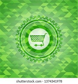 shopping cart icon inside green mosaic emblem
