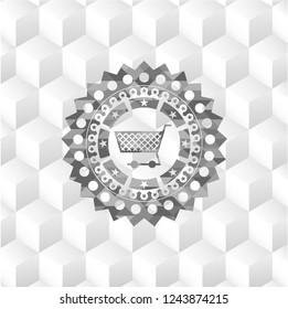 shopping cart icon inside grey badge with geometric cube white background