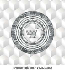 shopping cart icon inside grey badge with geometric cube white background