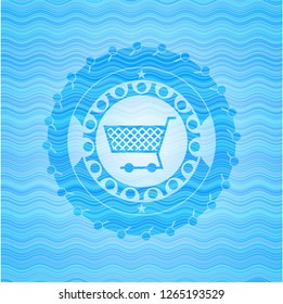 shopping cart icon inside light blue water wave badge background.