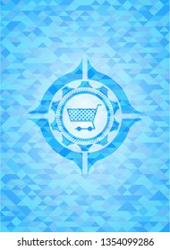 shopping cart icon inside realistic light blue emblem. Mosaic background