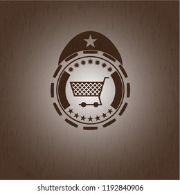 shopping cart icon inside retro style wooden emblem