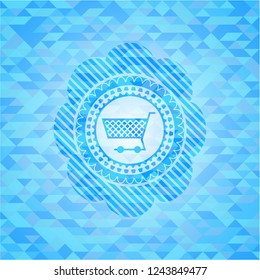 shopping cart icon inside sky blue mosaic emblem