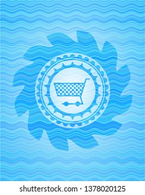 shopping cart icon inside sky blue water badge.