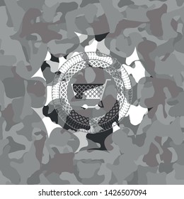 shopping cart icon on grey camouflaged pattern
