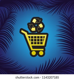 Shopping cart icon with a recycle sign. Vector. Golden icon with black contour at blue background with branches of palm trees.