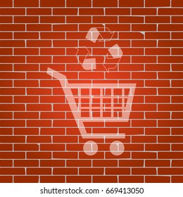 Shopping cart icon with a recycle sign. Vector. Whitish icon on brick wall as background.