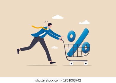 Shopping discount percentage, mortgage loan interest rate or investment earning and profit concept, businessman investor or consumer pushing shopping cart trolley with big percentage sign.