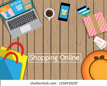shopping online background with computer,phone,shopping bags,coupons and credit card
