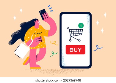 Shopping online and electronic payment concept. Young smiling woman cartoon character standing with huge smartphone screen with shopping cart online and holding credit card vector illustration