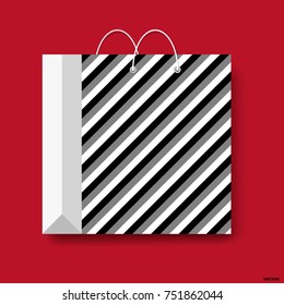 Shopping paper bag, vector shopping symbol isolated on a red background.