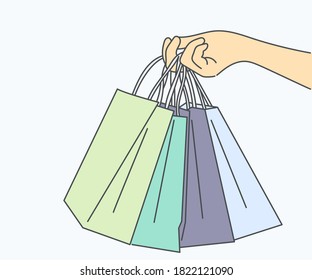 Shopping, sale, choice, store, buy concept. Human character hand holding shopping bags. Hand drawn in thin line style, vector illustrations.