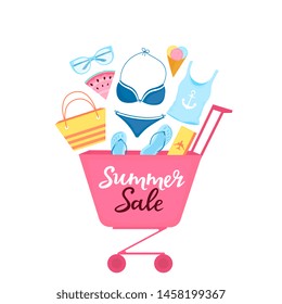 Shopping trolley with beach items and accessories for relaxing. Women's swimsuit, sunglasses, flip-flops, bag, plane ticket