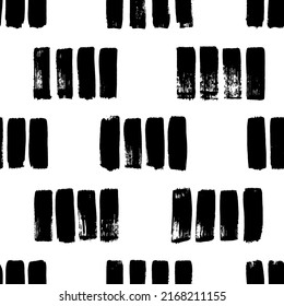 Short hand drawn strokes vector seamless pattern. Vertical black brush strokes in a row. Monochrome grunge texture in hipster style. Black paint dry brushstrokes. Short vertical lines or dashes