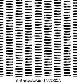 Short horizontal lines hand drawn seamless pattern. Grunge ink brush vector texture. Black paint dry brushstrokes. Freehand textured drawing. Abstract background design. Textile, wrapping paper.
