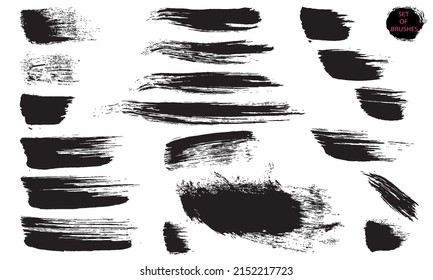 Short and long strokes with a dry brush. Grunge textures. A collection of vector black brushes isolated on a white background. Abstract modern forms of lines.