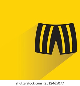 Icono de pantalones cortos con sombra sobre fondo amarillo