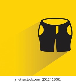 Icono de pantalones cortos con sombra sobre fondo amarillo