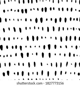 Short vertical lines hand drawn seamless pattern. Black and white simple vector confetti pattern with abstract dashes and lines. Horizontal dotted stripes. Grunge dash stain background for textile