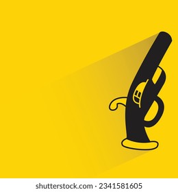 shotgun with shadow on yellow background