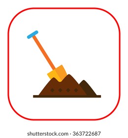 Shovel in heap of soil