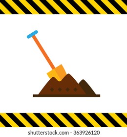 Shovel in heap of soil