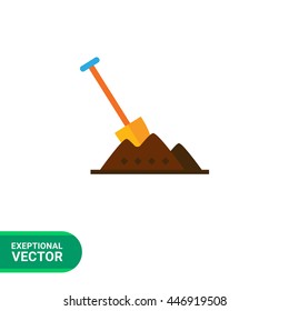 Shovel in heap of soil