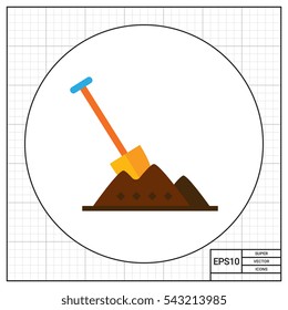 Shovel in heap of soil