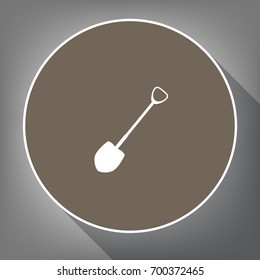 Shovel to work in the garden. Vector. White icon on brown circle with white contour and long shadow at gray background. Like top view on postament.
