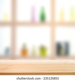 Showcase bottle shelves blurred over wooden tabletop. Vector illustration.