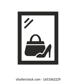 Showcase with shoe and handbag. Shopping icon. Vector icon isolated on white background.