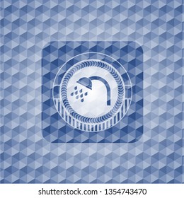 shower icon inside blue badge with geometric pattern.
