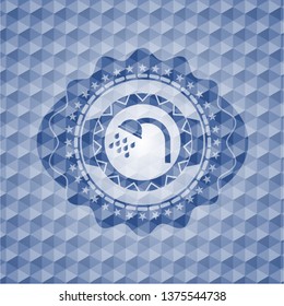 shower icon inside blue badge with geometric pattern.