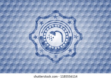 shower icon inside blue emblem with geometric pattern.