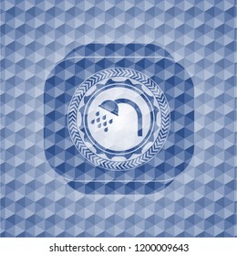 shower icon inside blue emblem with geometric background.