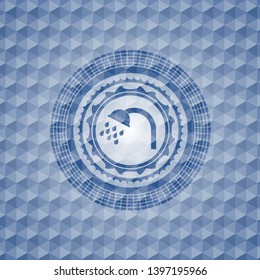 shower icon inside blue emblem with geometric pattern background.