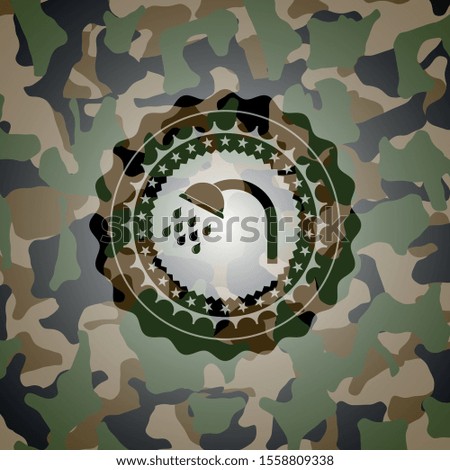 shower icon inside camouflage emblem