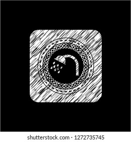 shower icon inside chalkboard emblem written on a blackboard