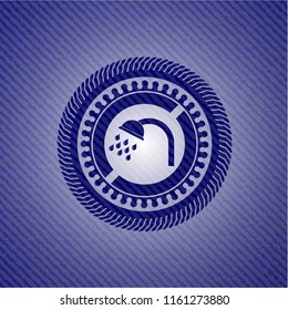 shower icon inside emblem with jean background